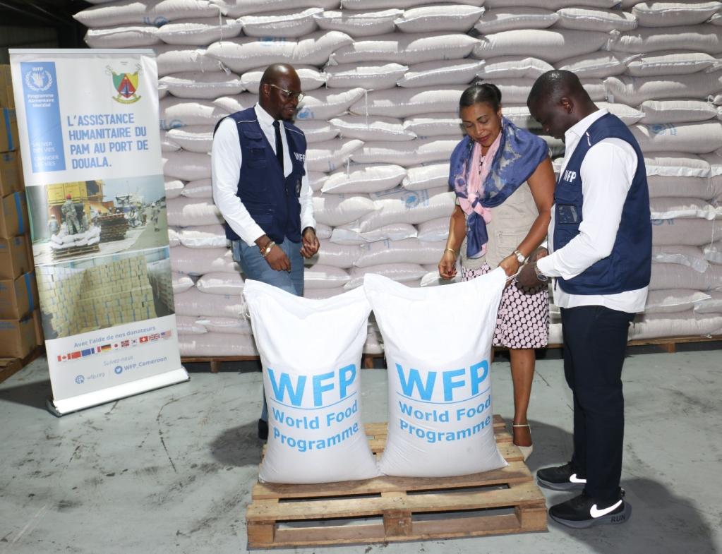 The Deputy Regional Director of WFP Regional Bureau in Dakar, Ms. Evelyn Etti and the Country Director ad interim, Mr. Aboubacar Guindo assessing the food storage and management of commodities in the MAERSK logistics supplier warehouse in Douala