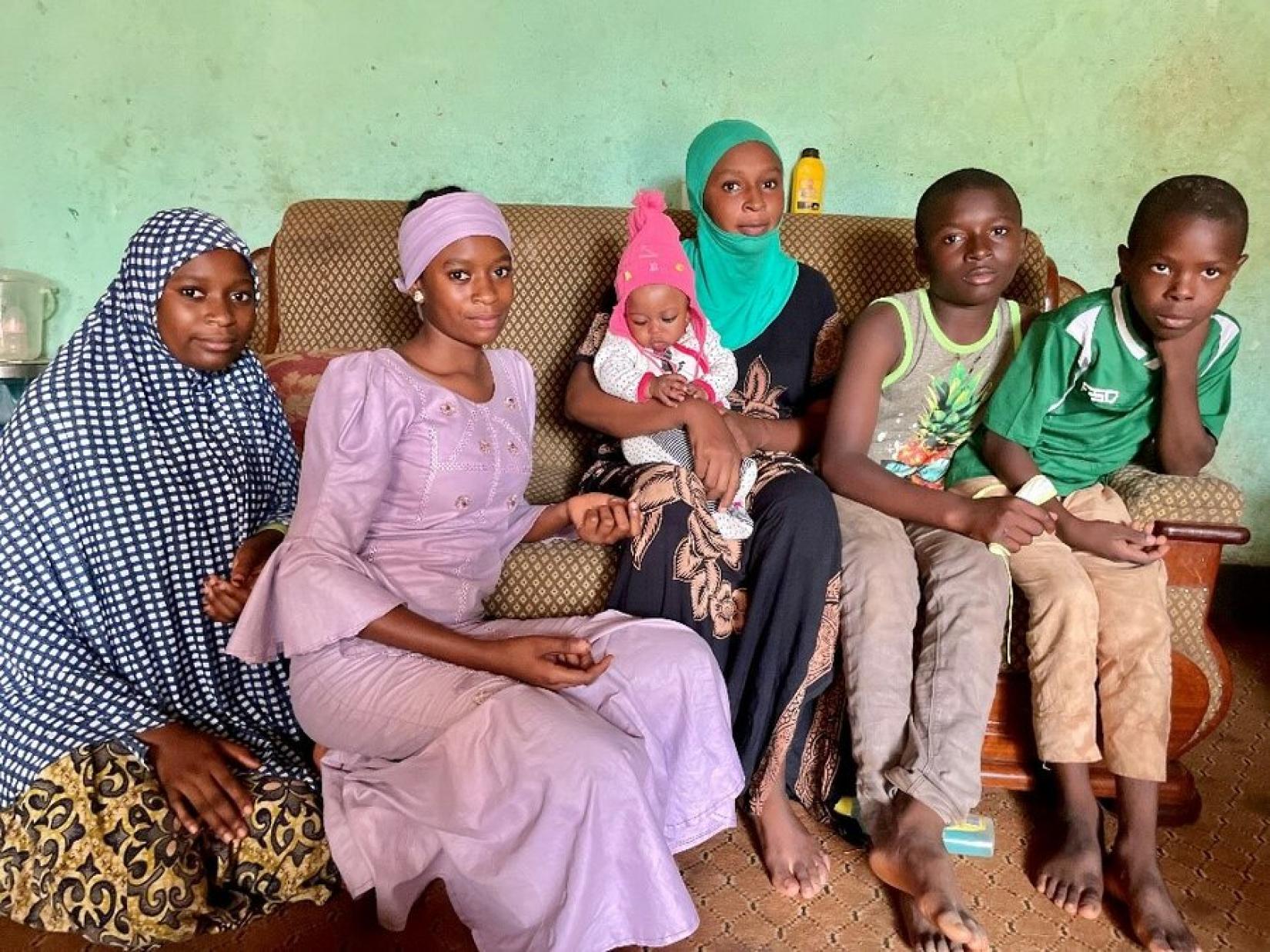 Djanabou and her children in their two-room house. 