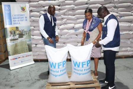 The Deputy Regional Director of WFP Regional Bureau in Dakar, Ms. Evelyn Etti and the Country Director ad interim, Mr. Aboubacar Guindo assessing the food storage and management of commodities in the MAERSK logistics supplier warehouse in Douala