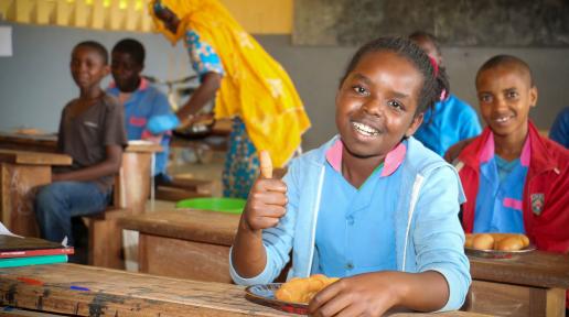 Aissatou KANGUE, a CM2 student at the Beka Matali public primary school in the Adamaoua region, is enjoying one of her favorite meals: cassava bread made from cassava flour and hard-boiled eggs, provided by the World Food Programme